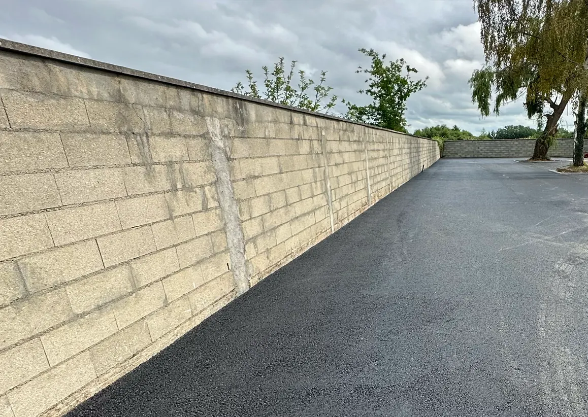 Fondations béton armé pour clôture et muret en Essonne